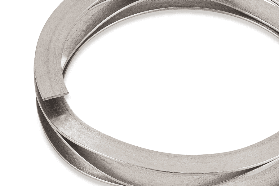 An image showing a wave spring with floating ends, commonly known as a wave spring rotor clip. The spring is intricately designed with undulating curves, allowing for flexibility and resilience in mechanical assemblies