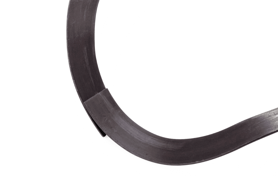 An illustration of a single-turn wave spring with overlapping ends, showcasing its innovative design for secure fastening and enhanced stability in mechanical assemblies. This configuration ensures reliable compression and deflection properties, suitable for various industrial applications