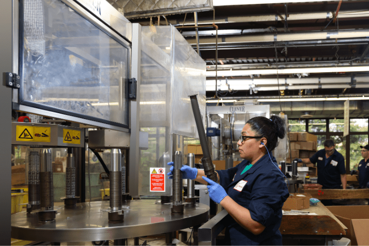 person stacking retaining rings for packaging
