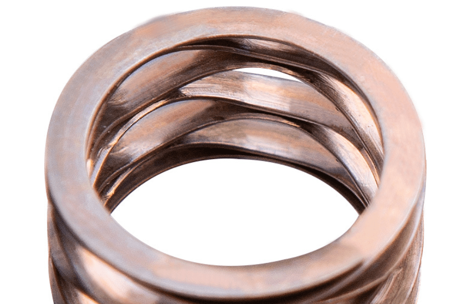 Image of a wave spring with shim ends, designed to provide increased stability and load capacity by incorporating flat, supportive shims at both ends of the spring