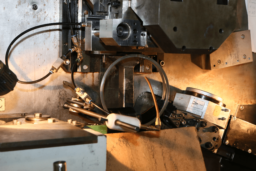 retaining ring being coiled by a machine
