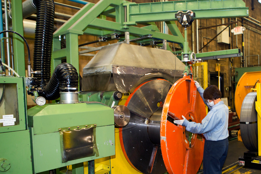woman producing wire for retaining rings