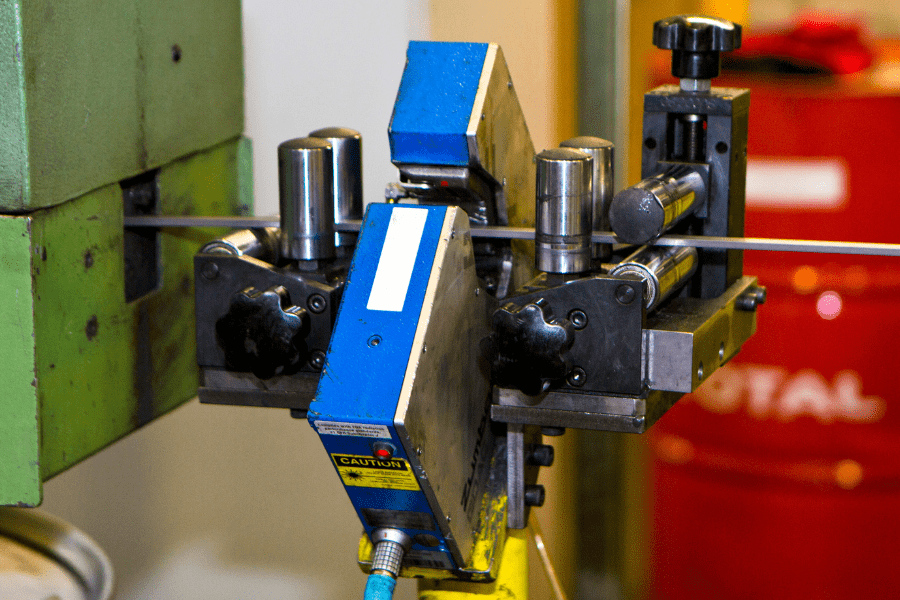 wire being stretched through machine